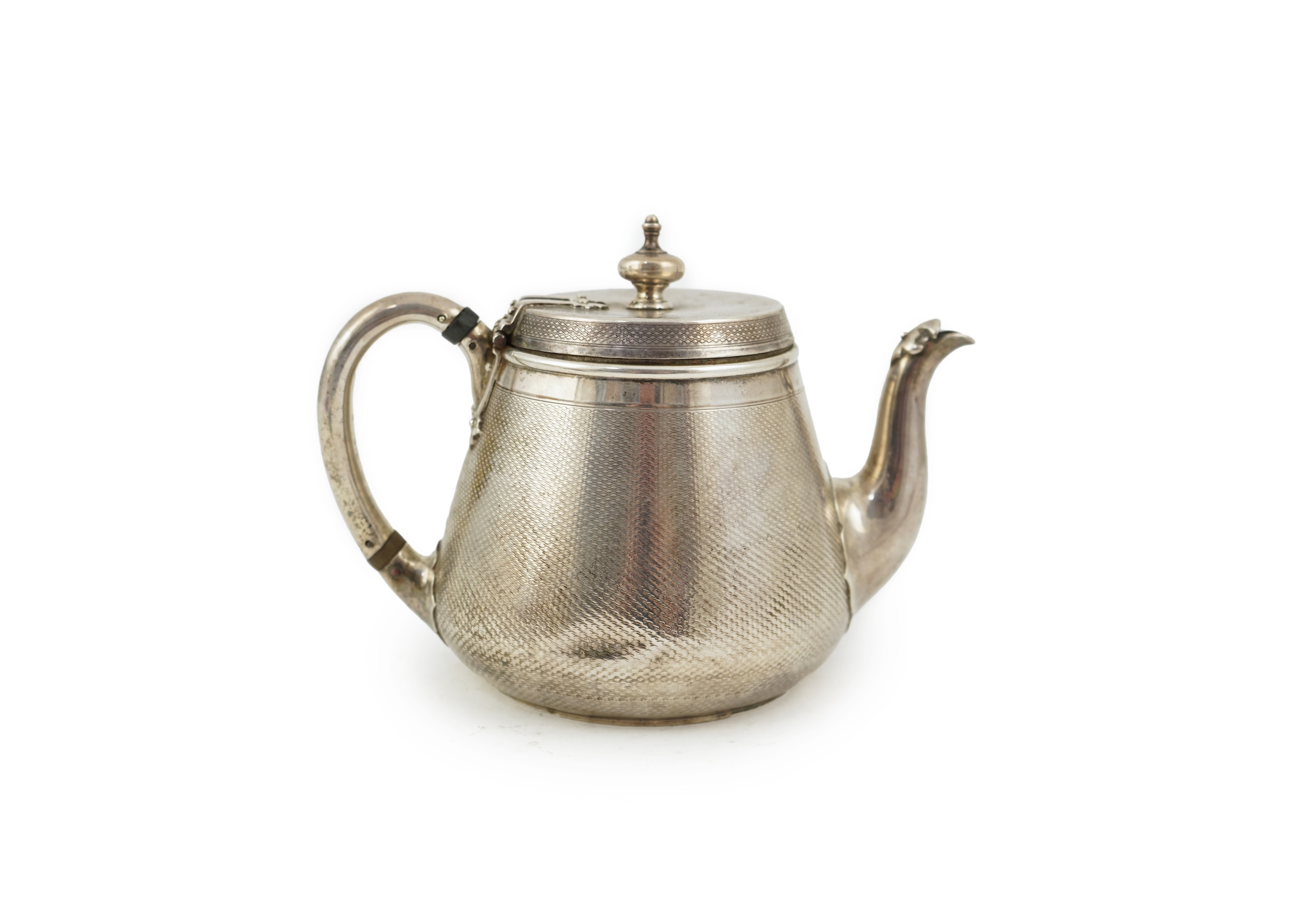 A Victorian engine turned silver teapot by Hunt & Roskell